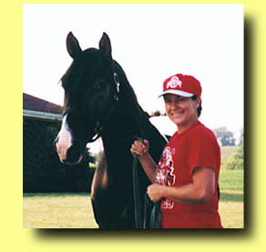 Karen Griffith and Senior Herd Stallion, Atahi